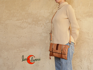 Bolso de mano de piel se le puede poner asa para bandolera