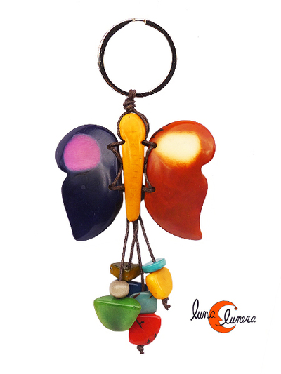 Llavero de semillas de tagua. Mariposa morada marrón.
