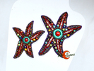Broches de porcelana. Estrellas de mar con el centro coral y turquesa.