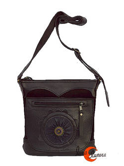 Bolso de piel y ante del taller Arco iris. Mediano negro con sol.
