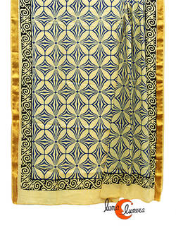 Pareo-fular de algodón con borde dorado, dibujos azules.